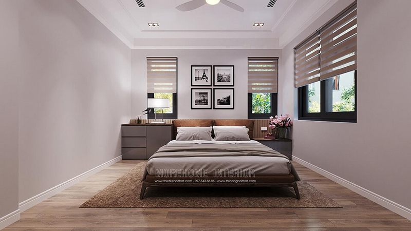 Mẫu giường ngủ gỗ tự nhiên cao cấp, đầu giường bọc đệm vải màu nâu cùng tầng màu với màu giường.